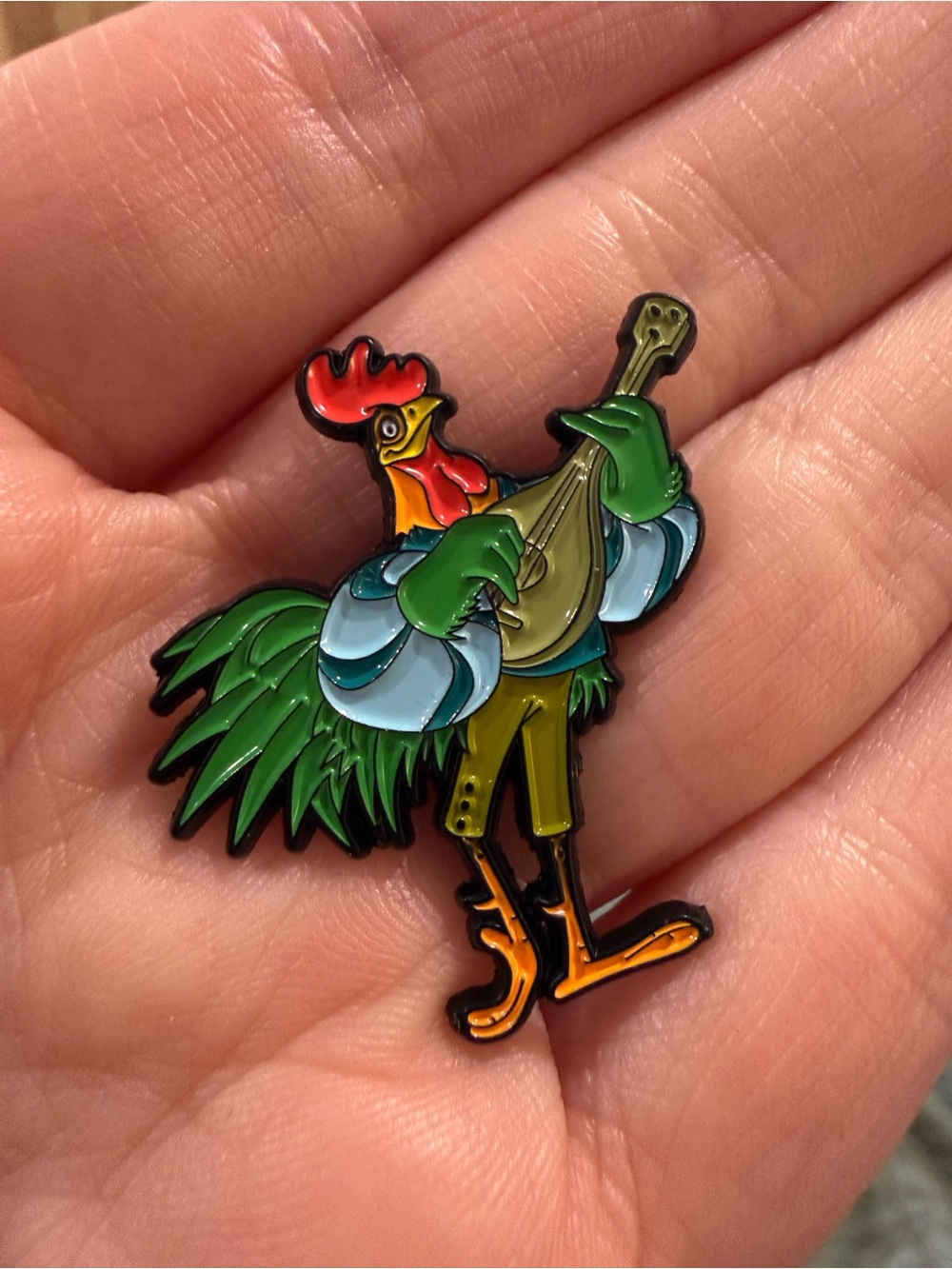 Disney Robin Hood inspired Allen-a-dale Rooster playing guitar enamel pin